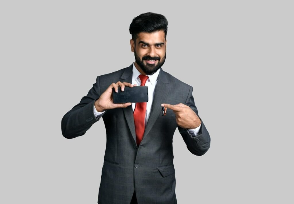 a man in a suit pointing